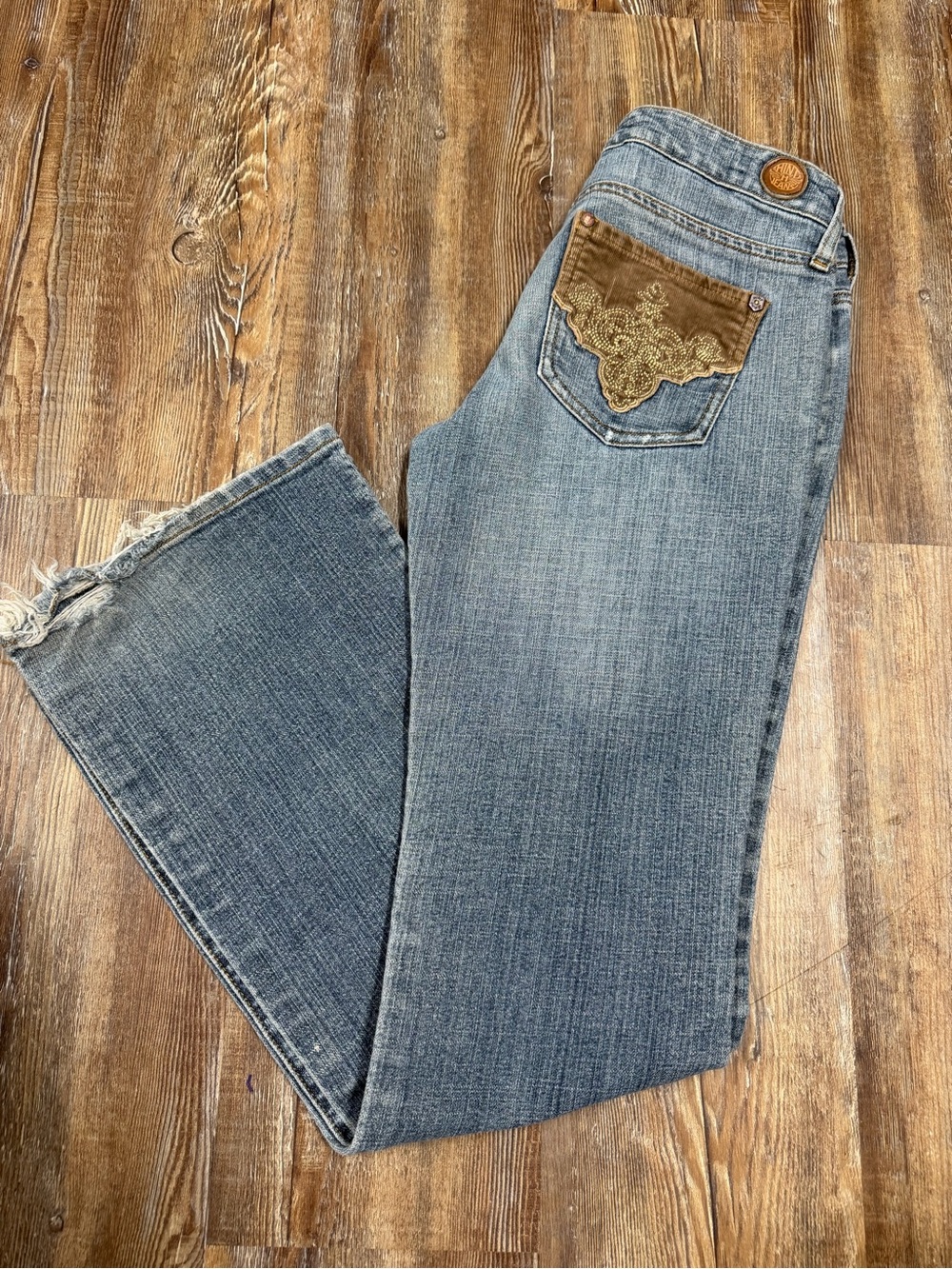 Vintage Y2K low rise flare jeans with brown embroidered pocket detail